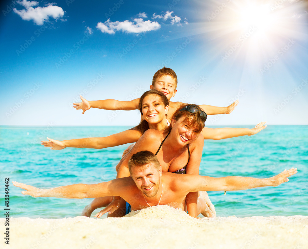 Vacation. Happy family having fun at the beach Vacation. Happy family having fun at the beach