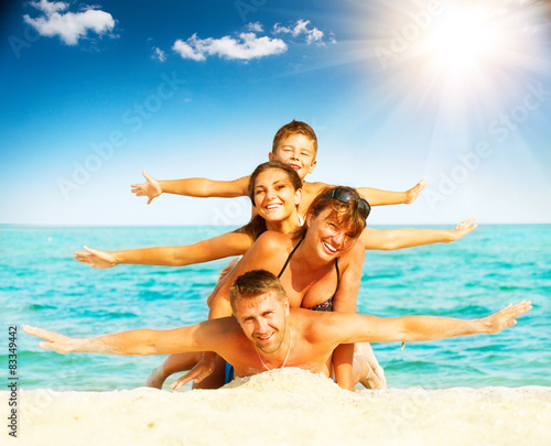 Vacation. Happy family having fun at the beach