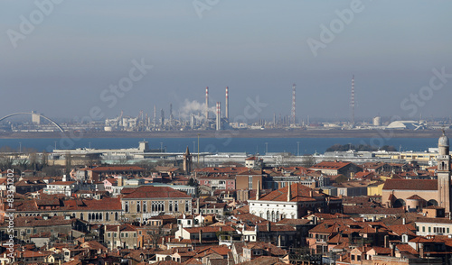 smokestacks and factories polluting with smoke near Venice