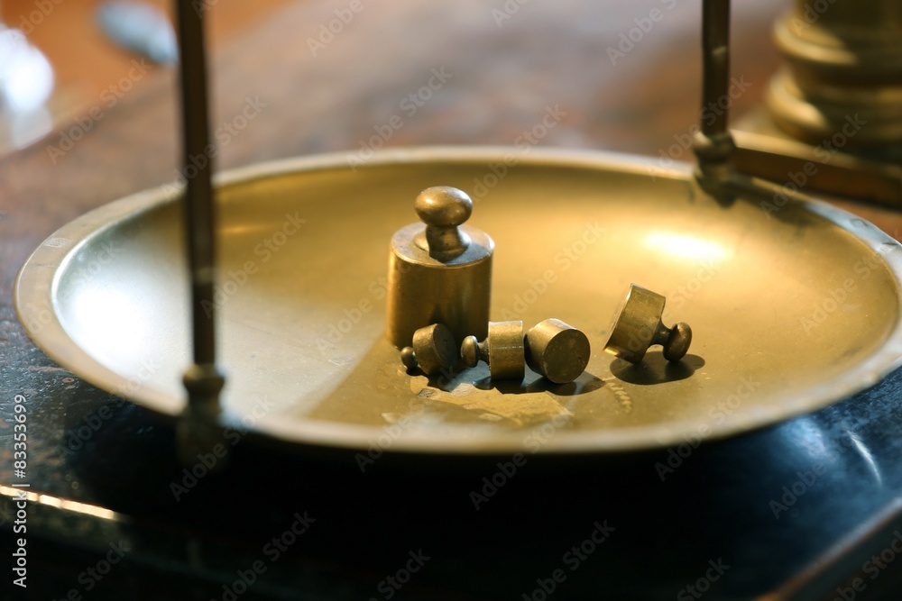 Obraz premium ancient brass precision scales with weights above the balance Pa