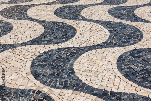 Typical portuguese cobblestone hand-made pavement calçada in Li