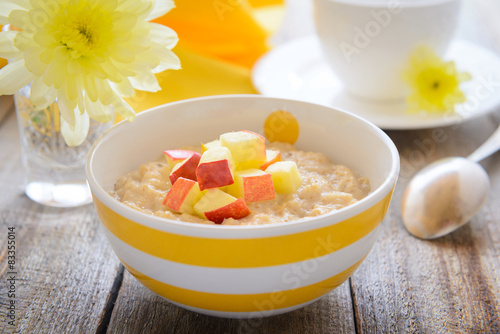 Healthy breakfast - oatmeal porridge with slice of apples