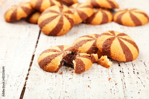 Delicious cookies on white wooden background