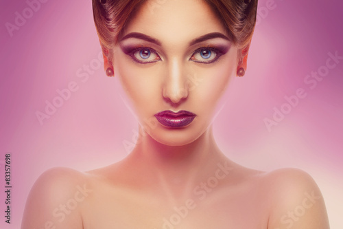 Horizontal portrait of cute female with make up in studio