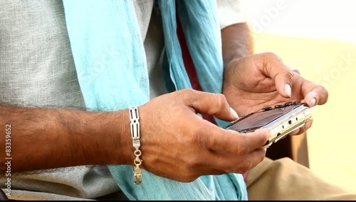 Male Model hands with cell phone photo