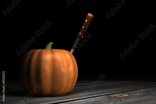 Pumpkin with a knife in it
