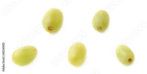 Five single white grapes isolated