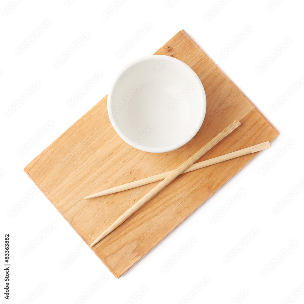 Ceramic bowl and chopsticks over the board Ceramic bowl and chopsticks over the board
