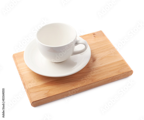 Fototapeta Naklejka Na Ścianę i Meble -  Empty cup on a wooden board isolated