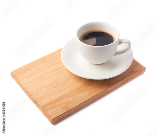 Fresh cup of coffee on a serving board