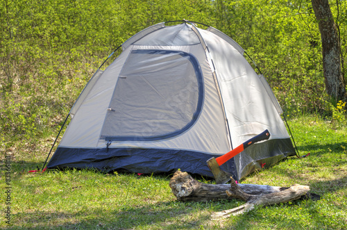 Camping tent in sunny forest