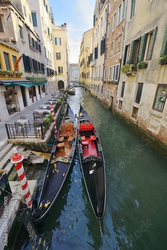 2 gondolas on a canal in Venice, Italy © marcobarone