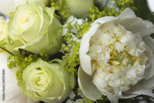Detail of small bouquet with white roses for bride or bridesmaid