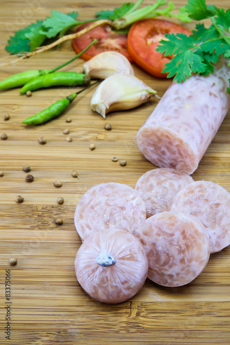 Thai style fermented sausage called Neam on wood background