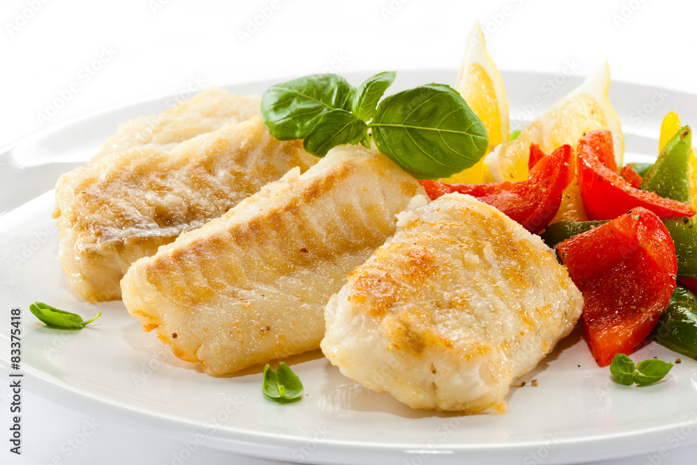 Fish dish - fried fish fillets and vegetables Fish dish - fried fish fillets and vegetables