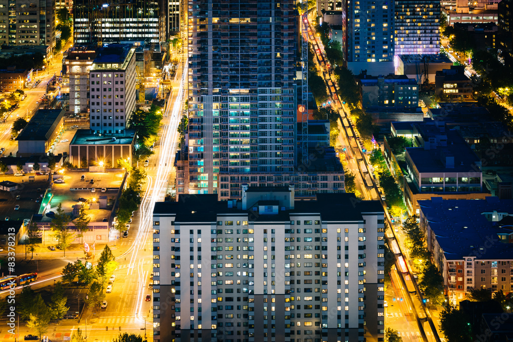 View of buildings and streets in downtown Seattle at night, in S View of buildings and streets in downtown Seattle at night, in S