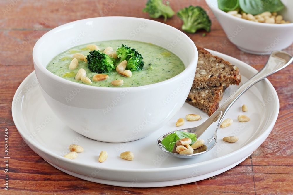 Broccoli-potato soup with pine nuts and broccoli topping Broccoli-potato soup with pine nuts and broccoli topping