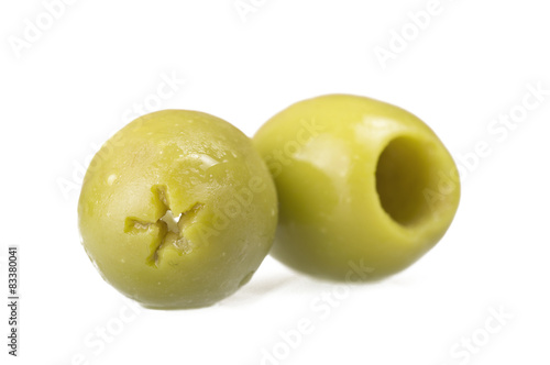 Pitted green olives close up on the white