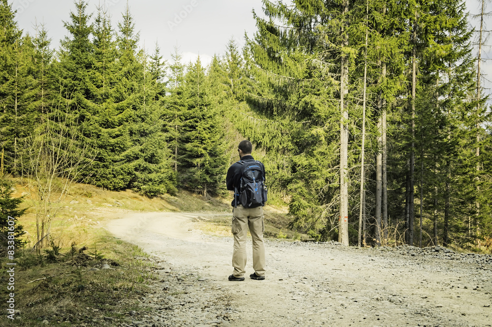 Obraz premium Man With Backpack Hiking in Spring