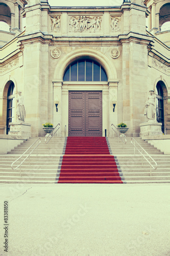 iron doors and red carpet entrance © nickjene