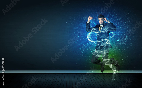 Talented cheerful businessman jumping with glowing energy lines