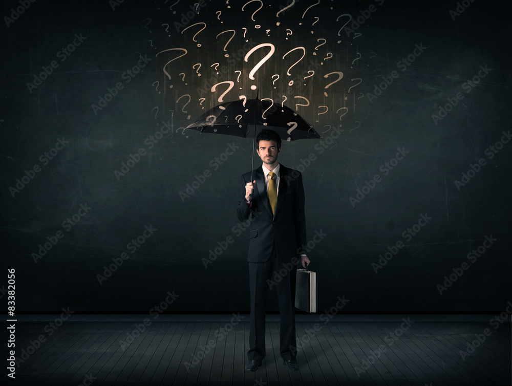 Businessman with umbrella and a lot of drawn question marks Businessman with umbrella and a lot of drawn question marks