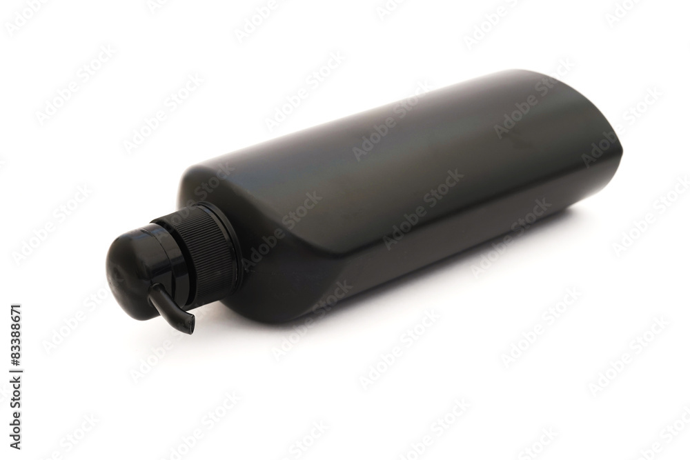 Fototapeta premium black plastic pump cosmetic bottle on white background