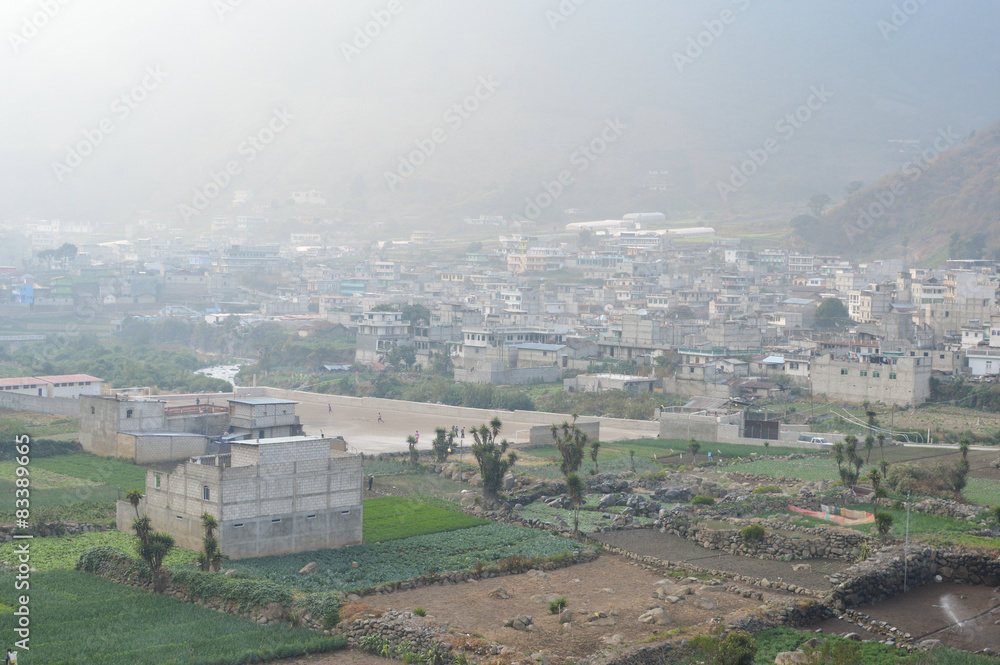 The mountain town of Zunil covered with fog