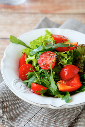 Fresh salad with tomatoes and arugula