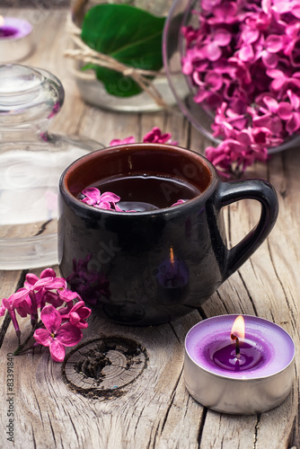 fragrant tea and a branch of lilac