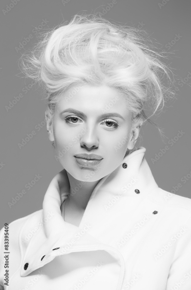 Blonde fashion woman sexy natural lips posed on blue background Blonde fashion woman sexy natural lips posed on blue background