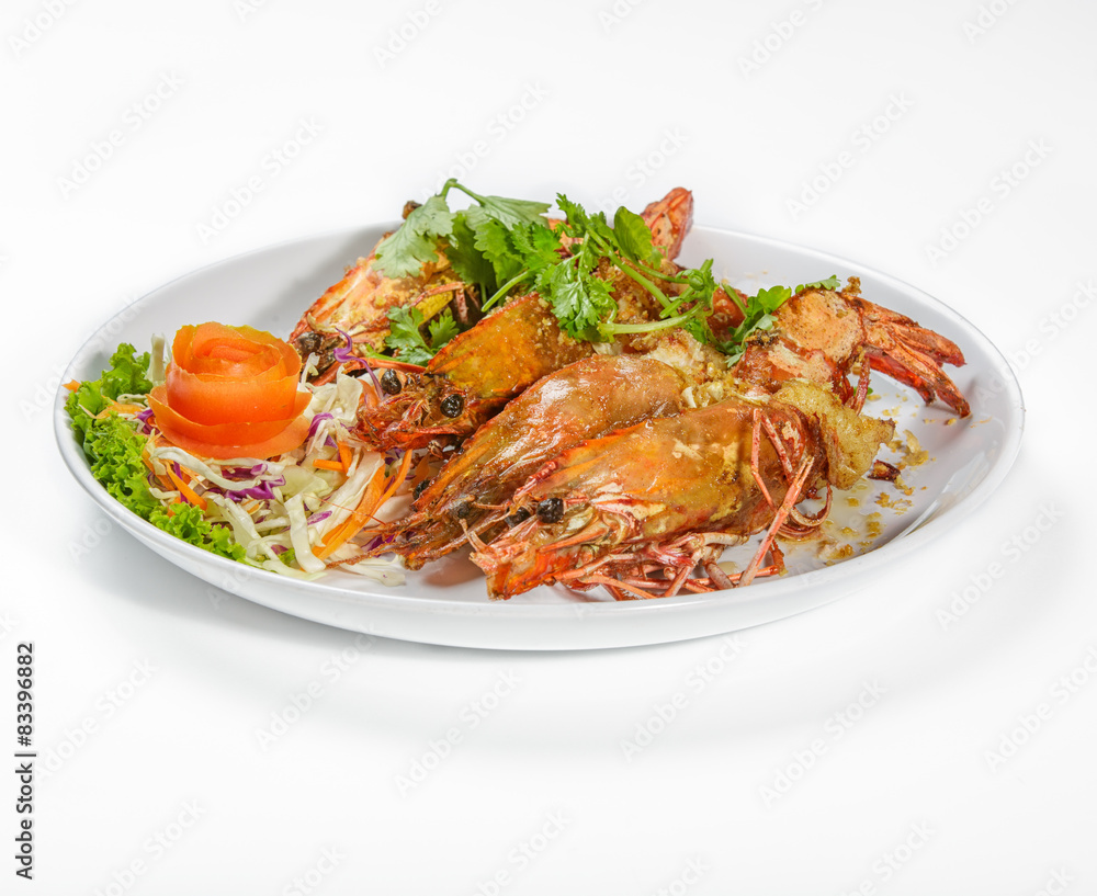 Grilled tiger prawns with vegetables isolated on white Grilled tiger prawns with vegetables isolated on white
