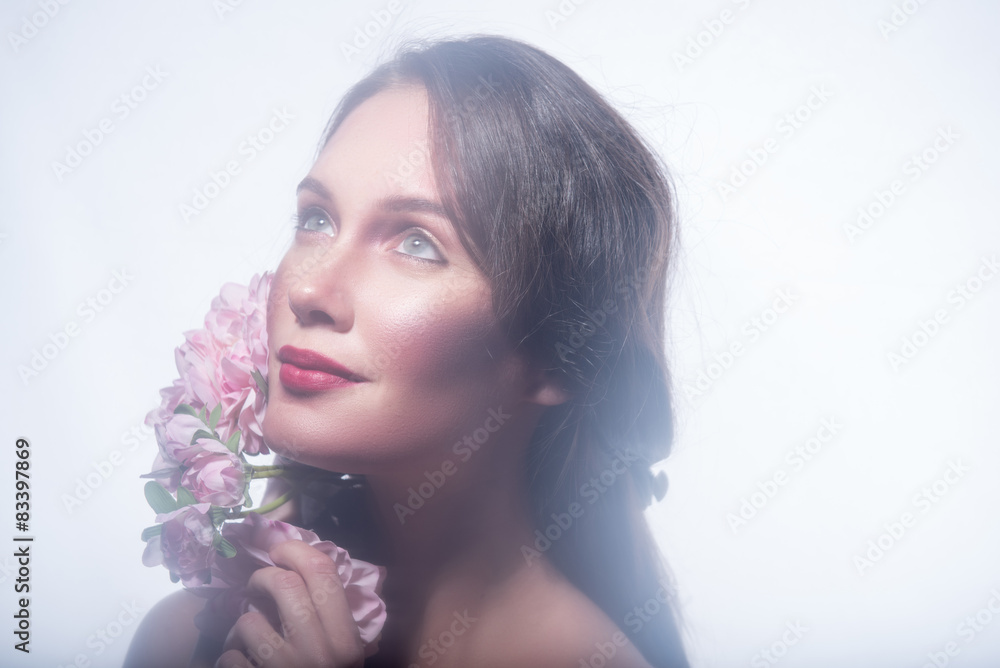 Girl in a wreath of beautiful flowers Girl in a wreath of beautiful flowers
