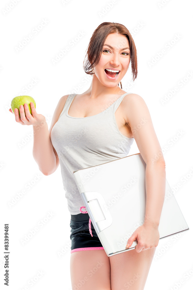 Portrait of slim girl with scales and apple Portrait of slim girl with scales and apple