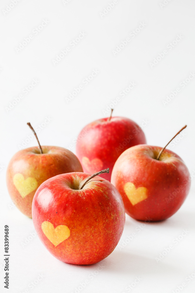 Red apples with a heart symbol