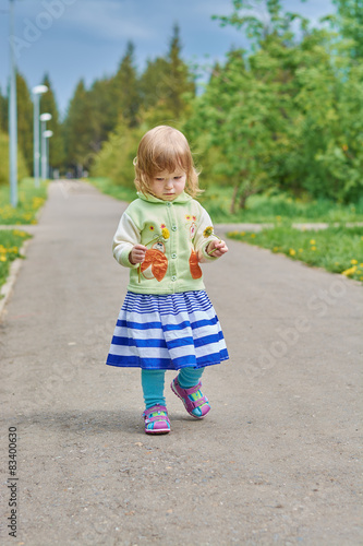 Little girl walks in the park © Ramil Gibadullin