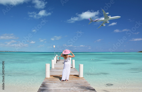 Girl on the wooden jetty looking to the ocean. Exuma, Bahamas © HappyAlex