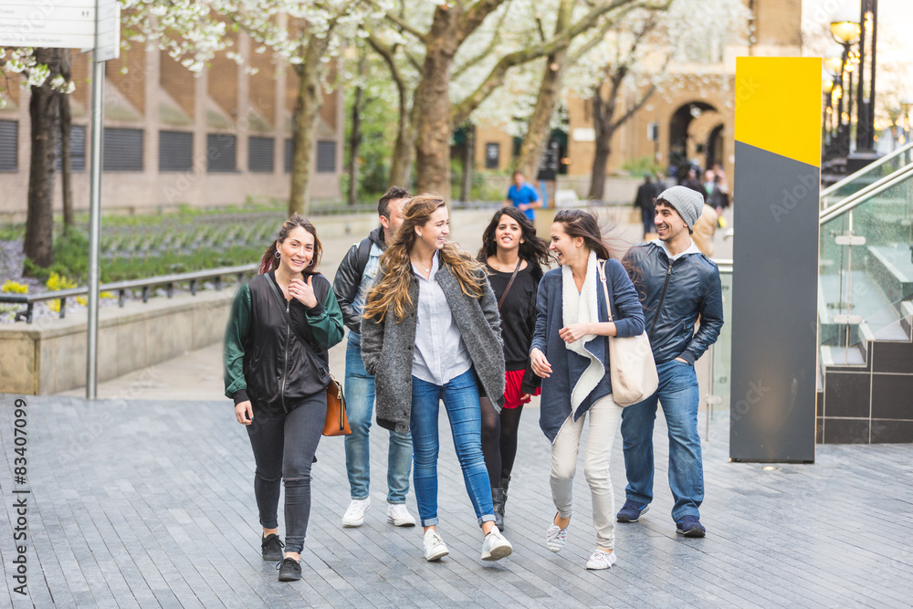 Fototapeta premium Group of friends walking and having fun together in London