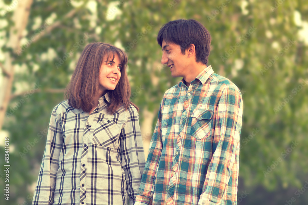 Fototapeta premium loving couple walking in a city park in spring