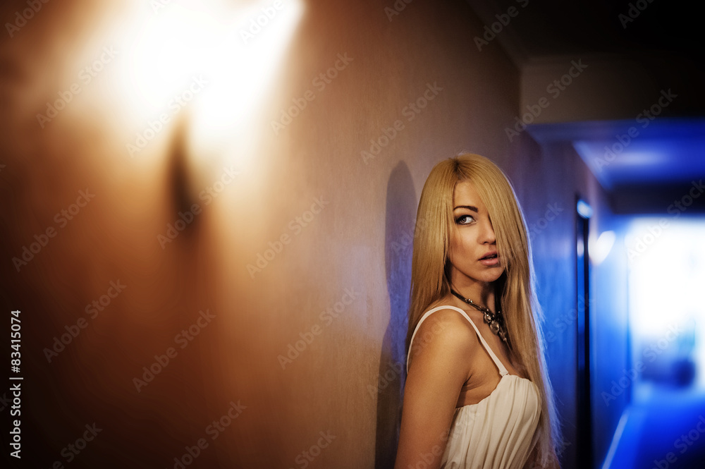 Beautiful blond woman in long dress