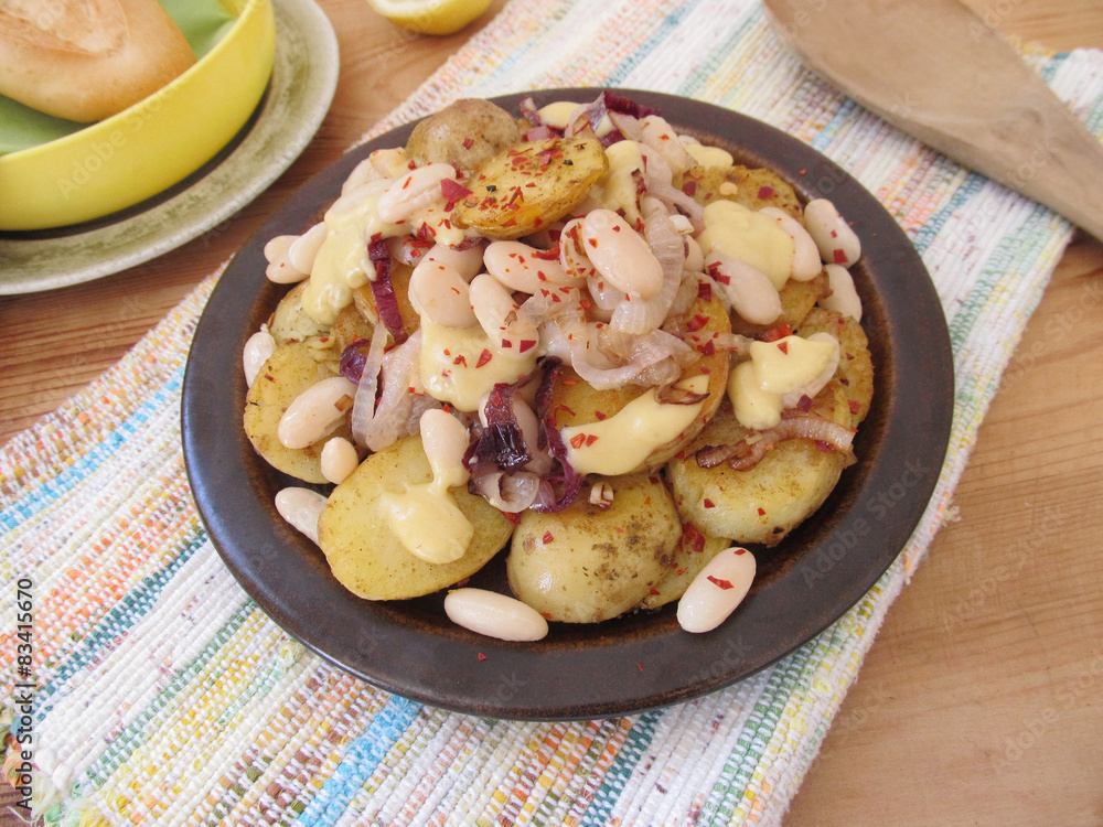 Fried potatoes with white beans.