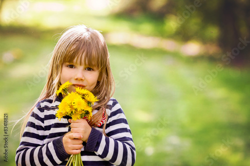 Beautiful little blonde girl  playing outdoor  springtime