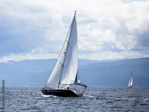 Sailing in the wind through the waves at the Aegean Sea.
