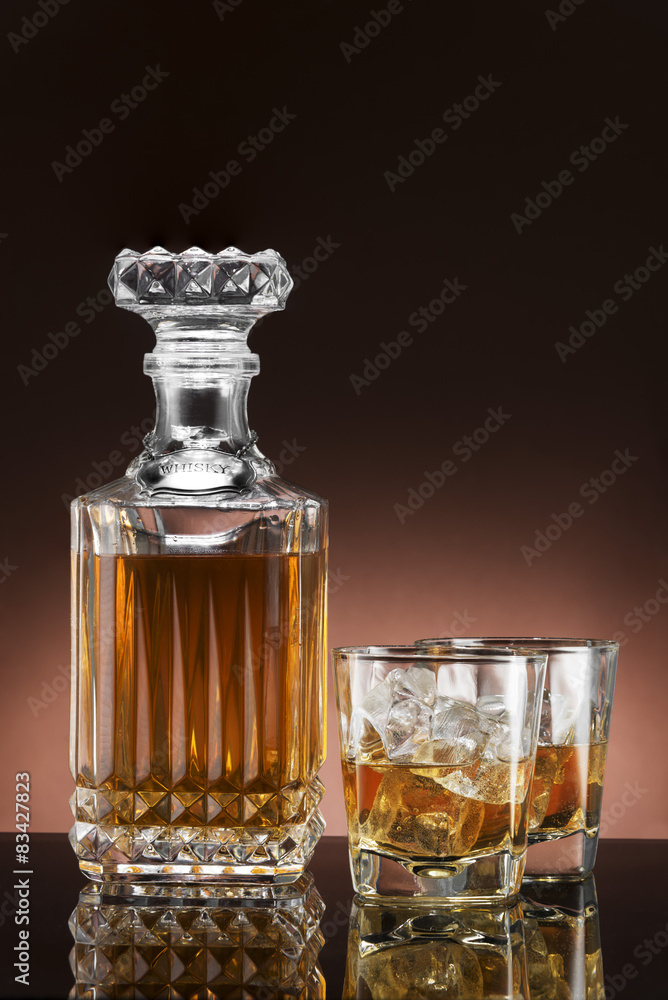 Glass and luxury bottle of liquor Glass and luxury bottle of liquor