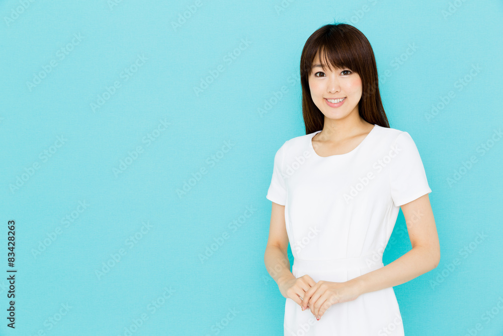 attractive asian nurse on blue background attractive asian nurse on blue background