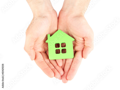 Female hands holding house isolated on white