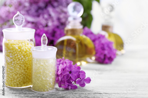 Spa treatment and flowers on light background