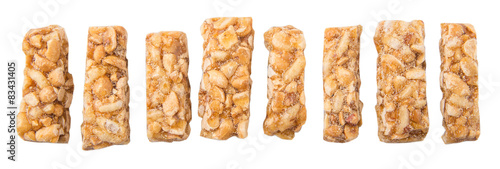 Caramelized candy nuts over white background 