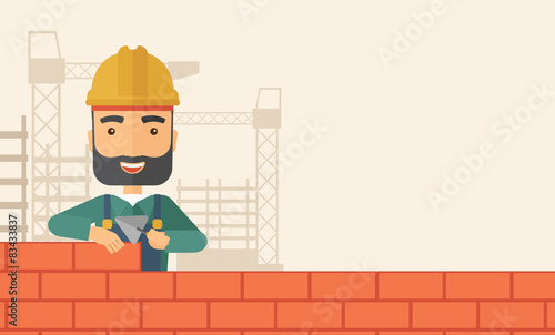 Builder man is building a brick wall. photo