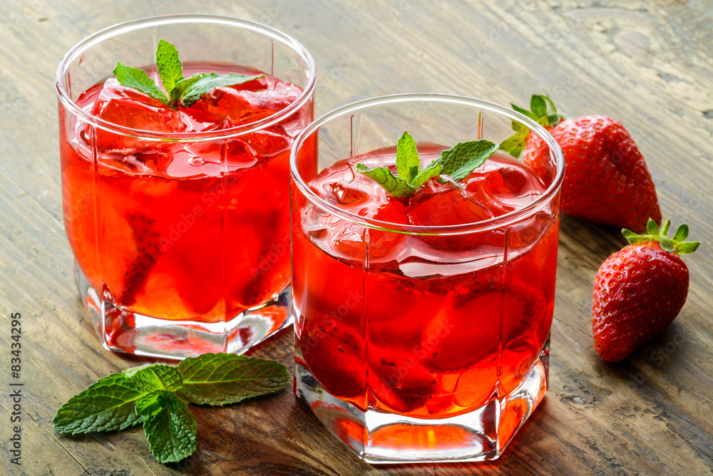 Cold strawberries drinks with strawberry slices and mint Cold strawberries drinks with strawberry slices and mint